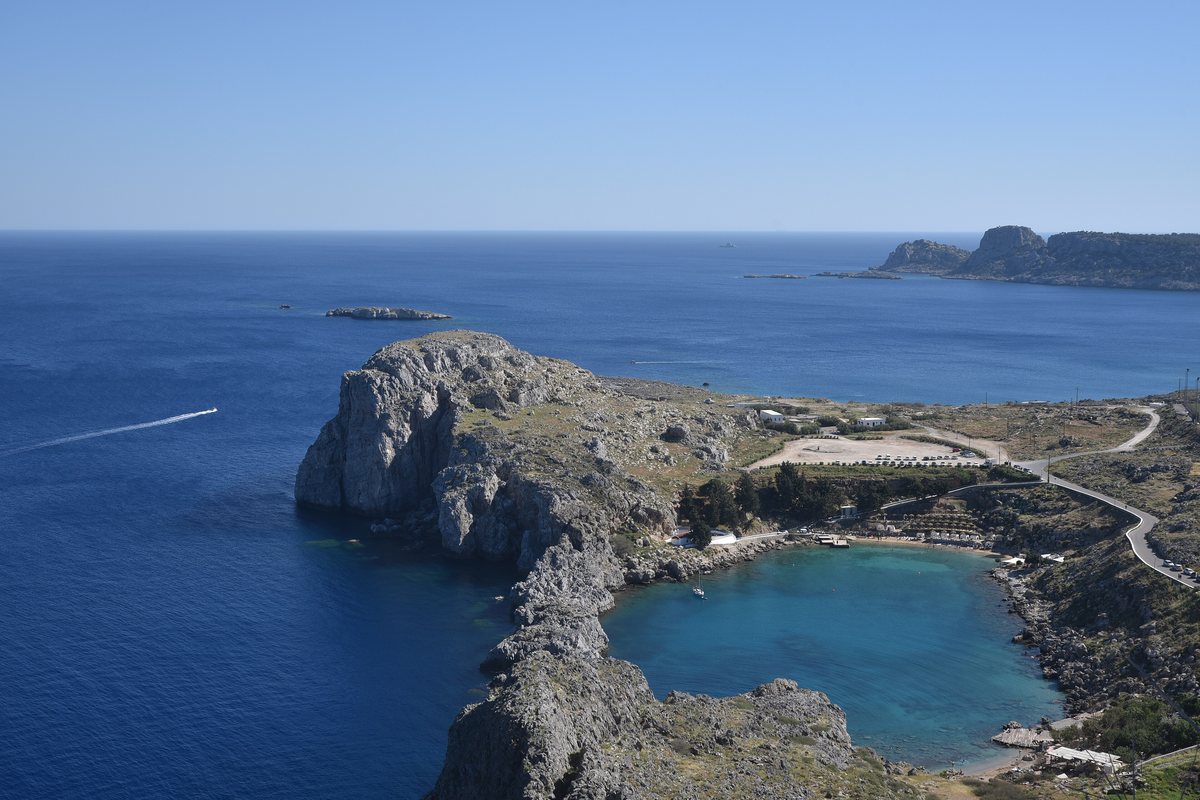 St Paul's Bay beneath the acropolis of Lindos on Rhodes.